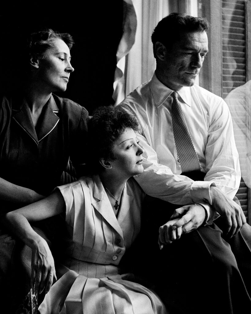 Édith Piaf, singer Eddie Constantine and Charles Aznavour, following tea at Grand Hôtel, Paris,